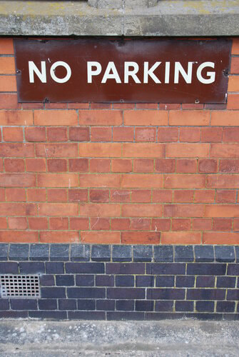 No parking sign on the wall.